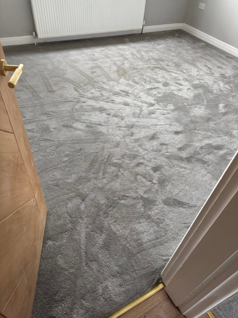 Plush grey bedroom carpet fitted by Cuttin Edge Carpets in a Halifax home