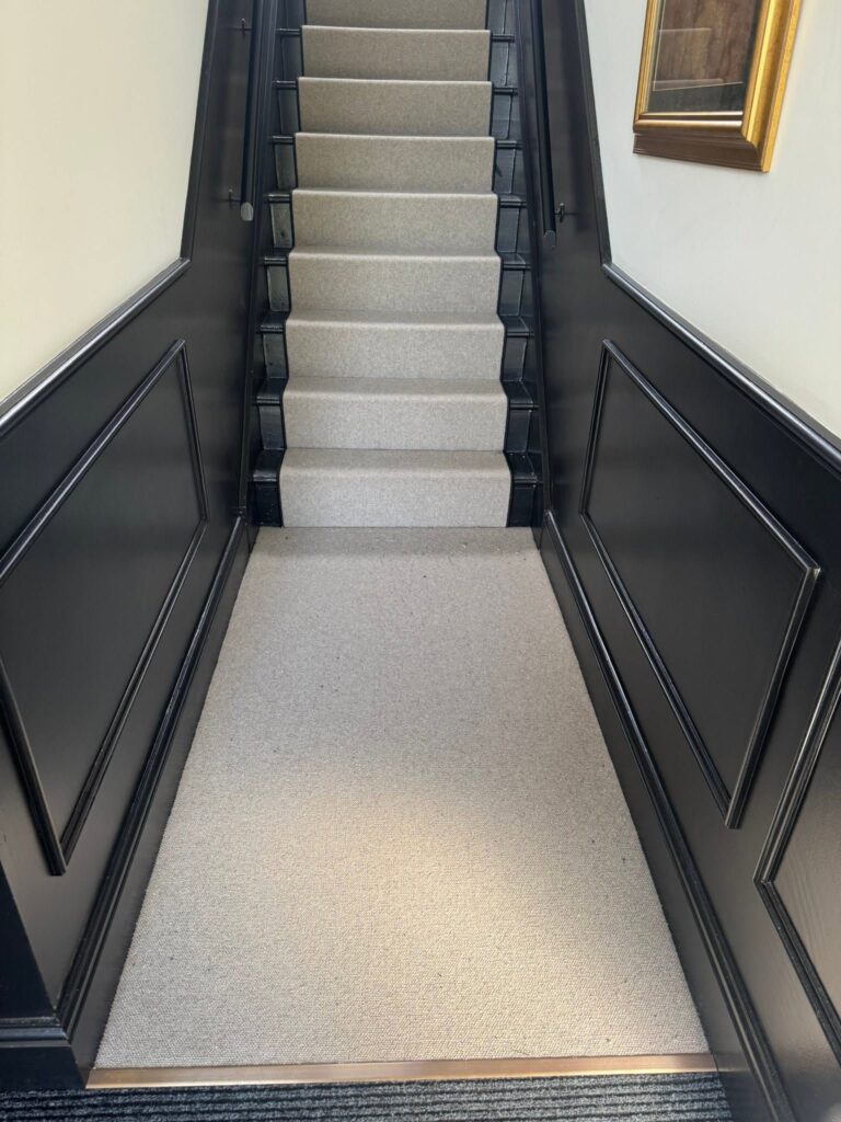 Grey stair runner and matching hall carpet fitted in a Halifax home by Cuttin Edge Carpets
