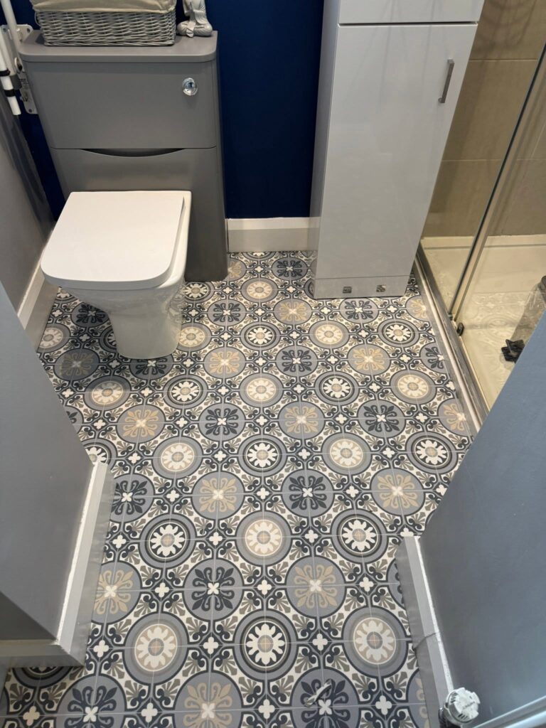 Patterned tile-effect vinyl flooring fitted in a Halifax bathroom by Cuttin Edge Carpets