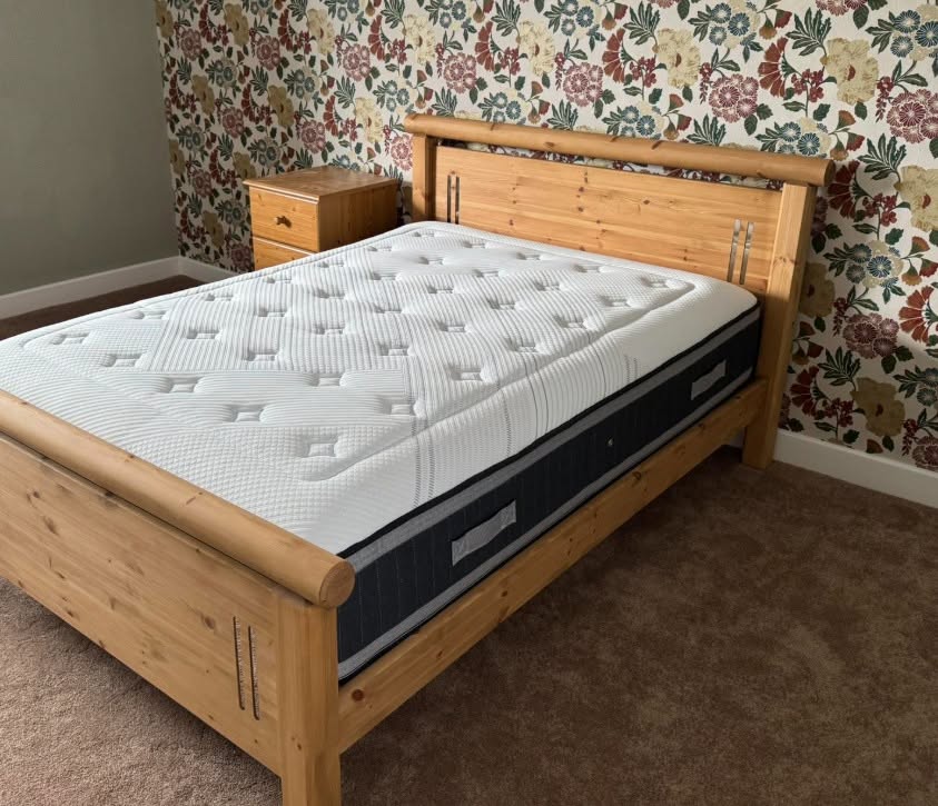 Solid pine bedstead with quality mattress fitted in a Halifax bedroom by Cuttin Edge Carpets and Beds
